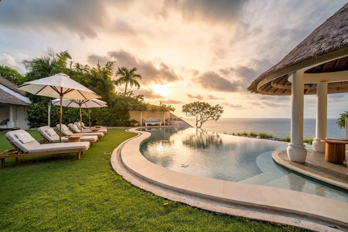 Infinity pool over the Bingin cliffs at golden hour, Uluwatu, Bali